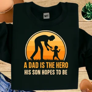 “A Dad Is The Hero His Son Hopes To Be” printed cotton T-shirt. Soft, breathable fabric with durable print. Perfect Father’s Day gift in UAE.