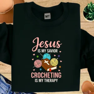 Jesus Is My Savior Crocheting Is My Therapy T-shirt for Christian yarn lovers. Soft cotton tee perfect for crocheters and faith-based gifts.
