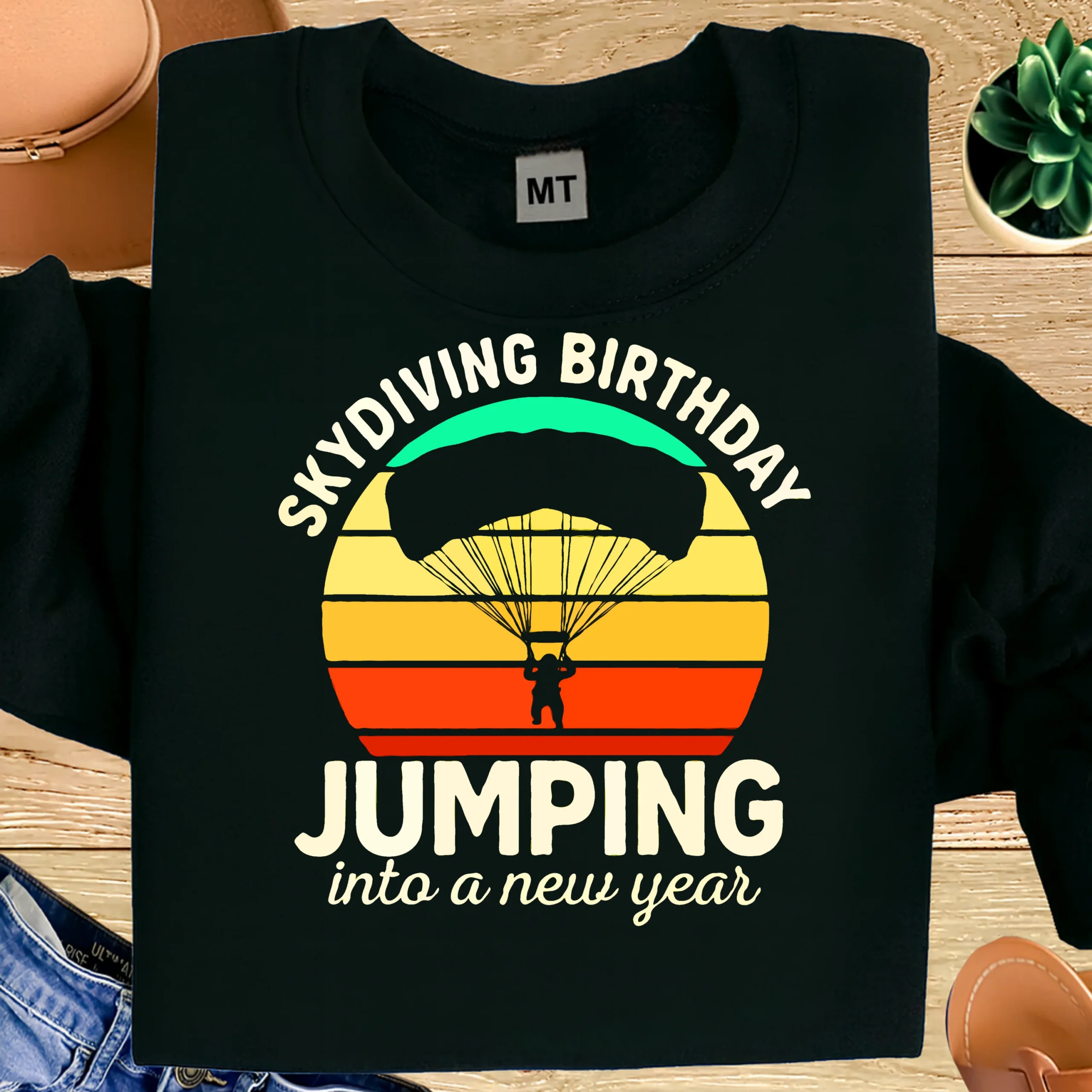 100% premium cotton skydiving birthday T-shirt. “Skydiving Birthday – Jumping Into a New Year” adventure graphic. Perfect gift for UAE skydivers.