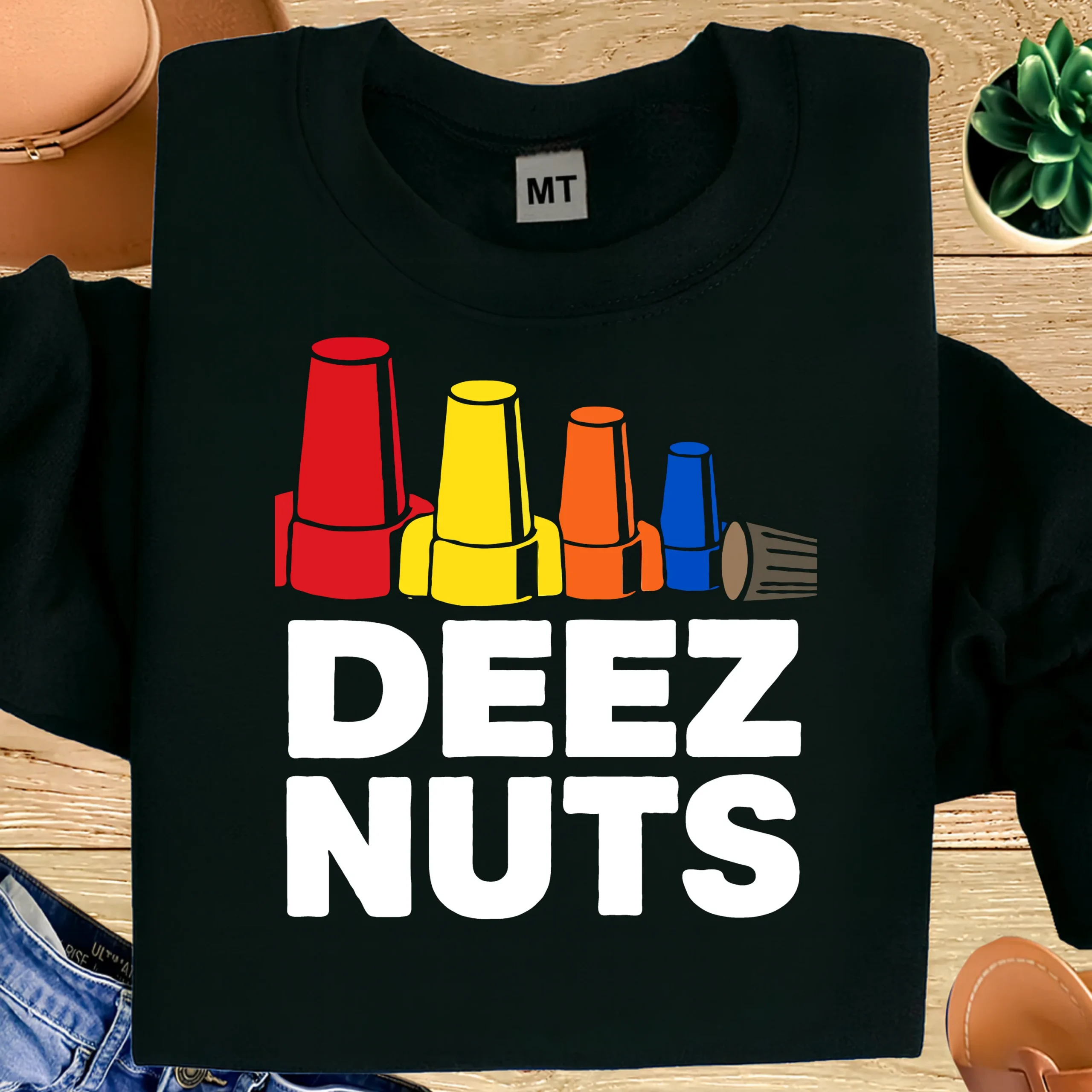 Funny electrician T-shirt featuring colorful wire nuts with “Deez Nuts” text. Premium cotton humor tee for electricians and trade workers.