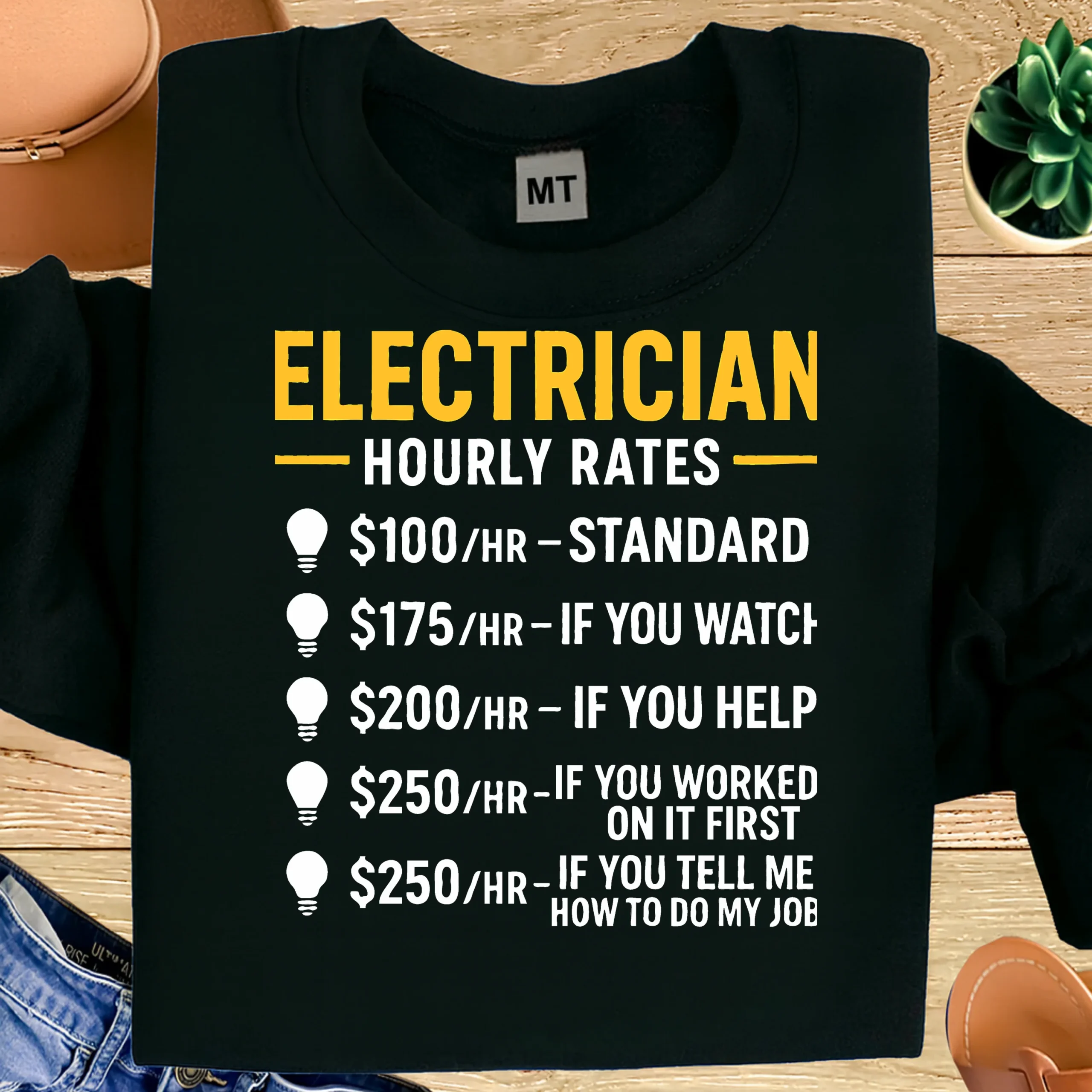Funny electrician T-shirt featuring “Electrician Hourly Rates” joke. Premium cotton tee perfect for electricians, linemen, and trade humor fans.