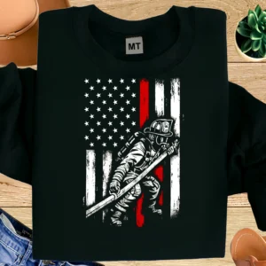 Patriotic firefighter T-shirt featuring American flag and heroic fireman design. Premium cotton tee for firefighters, first responders, and supporters.