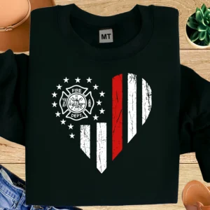 Show your firefighter pride with this heart-shaped American flag T-shirt. Features fire department emblem design—perfect gift for firefighters and fire families.