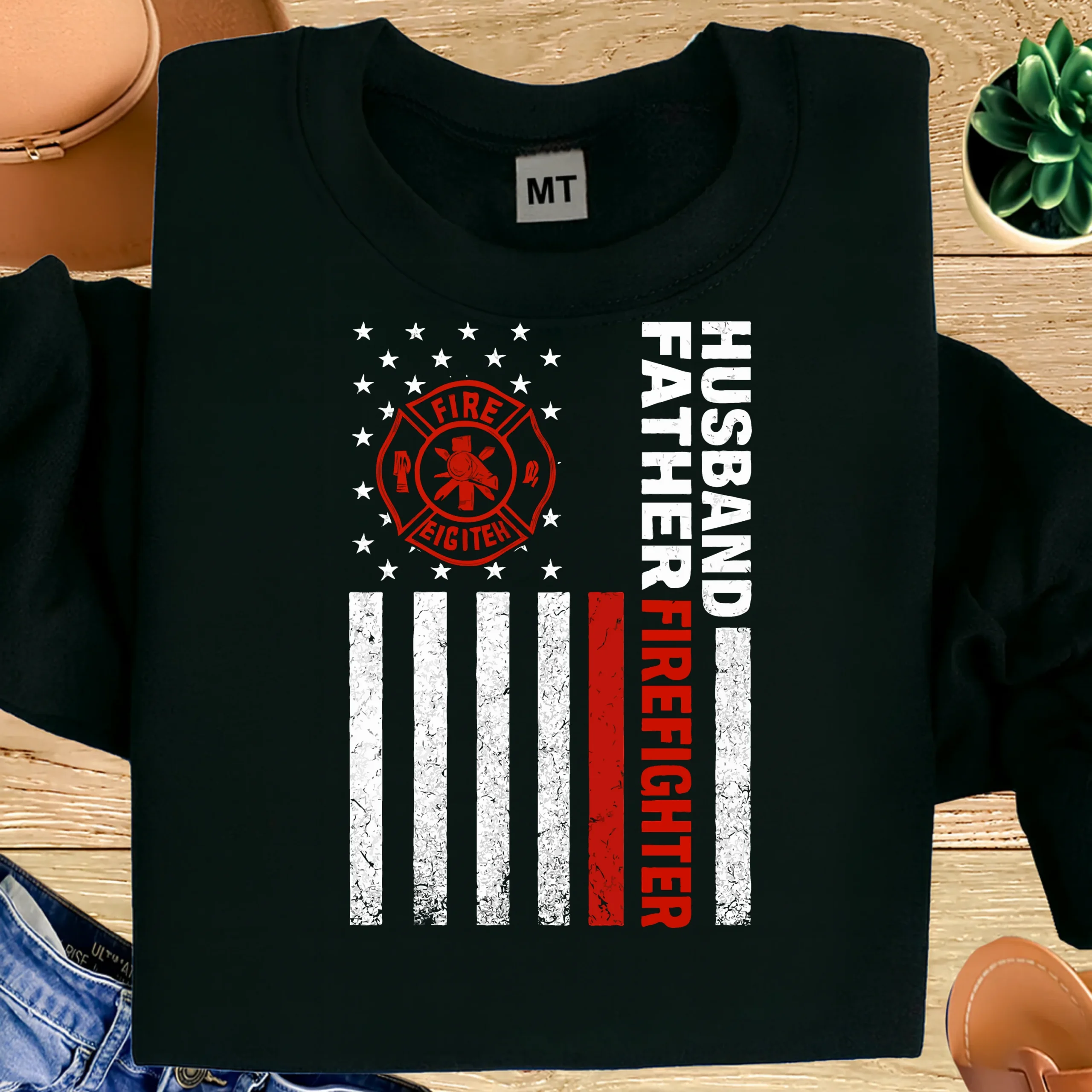 Proud “Husband Father Firefighter” T-shirt with thin red line American flag design. Premium cotton tee honoring firefighter family pride.