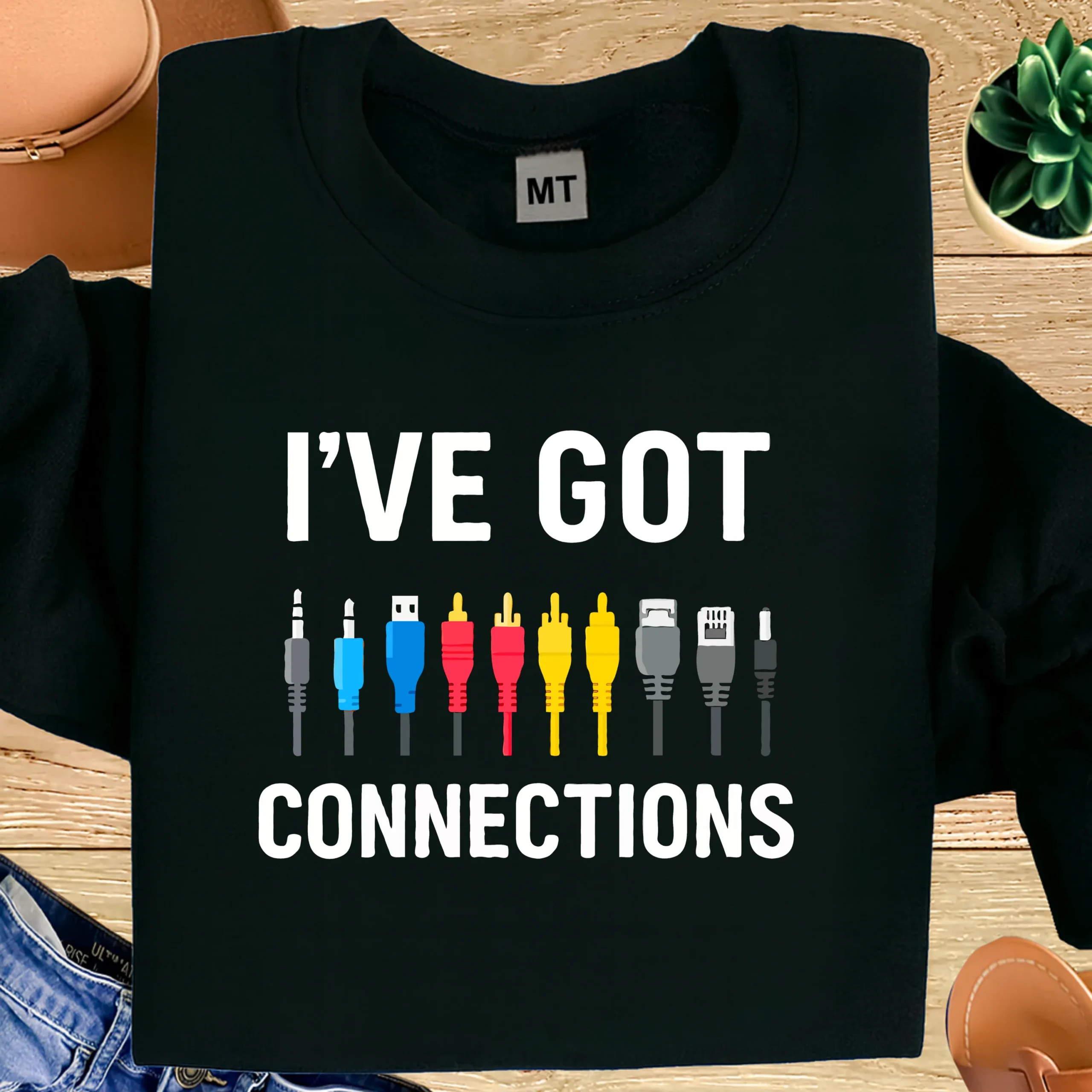 Funny “I’ve Got Connections” electrician T-shirt featuring cable and connector graphics. Premium cotton humor tee for electricians and tech lovers.