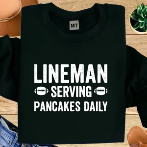 Funny lineman T-shirt featuring “Lineman Serving Pancakes Daily” design. Perfect football humor tee for players, fans, and linemen.
