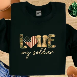 Love My Soldier T-shirt with American flag heart and combat boots design. Soft cotton tee for military wives, families, and proud supporters.