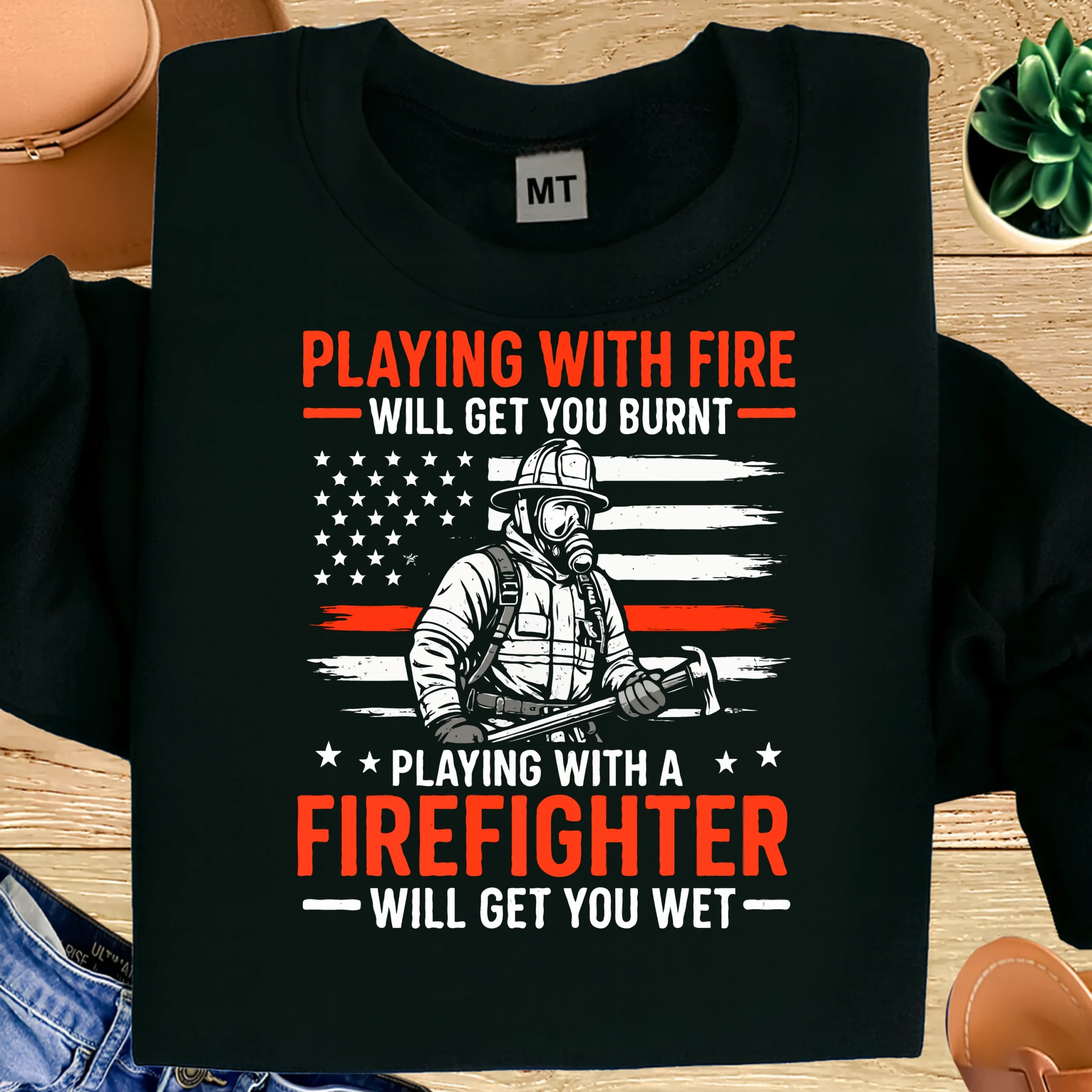 Funny “Playing with fire will get you burnt” firefighter T-shirt with bold graphic design. Premium cotton tee for firefighters who love humor and pride.